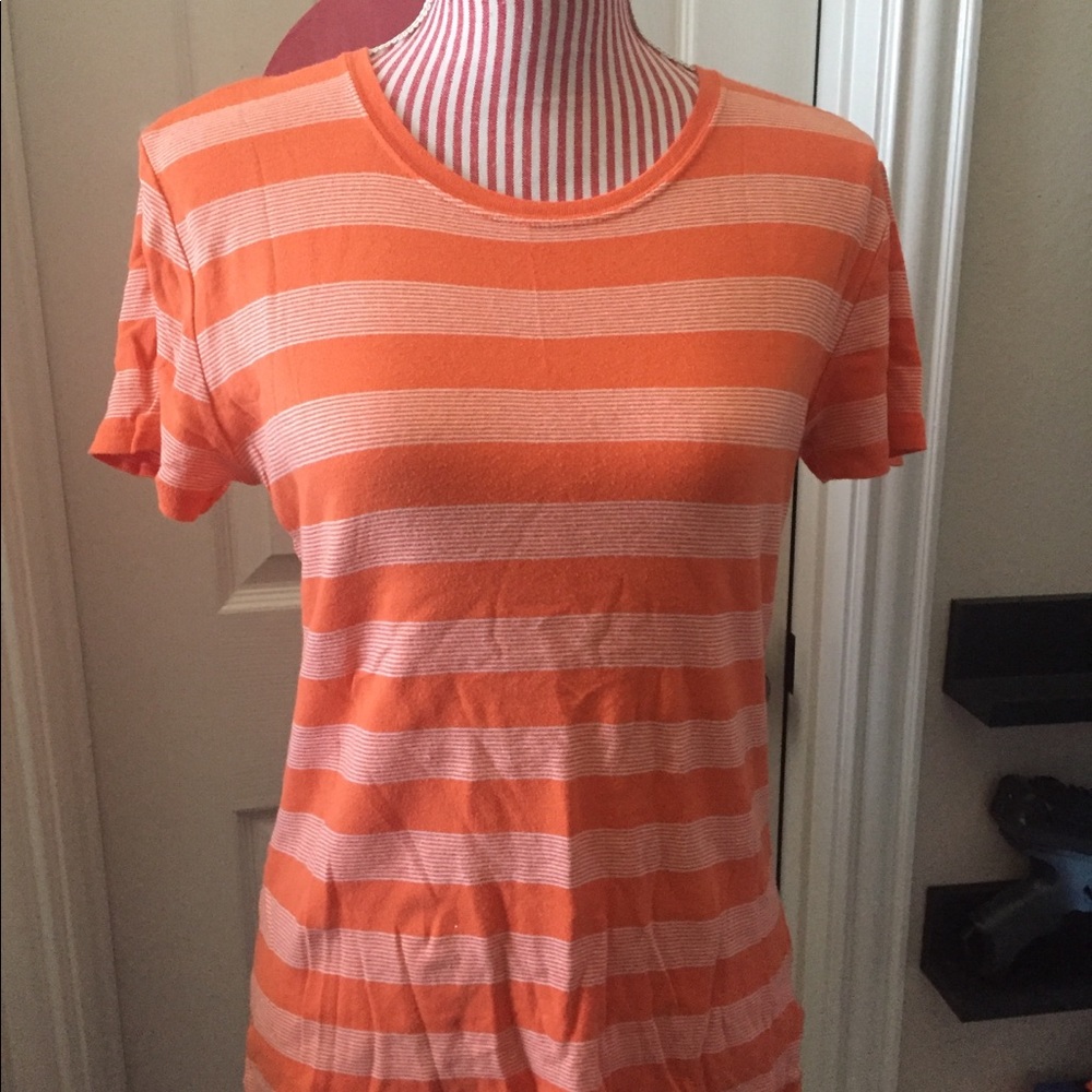 Orange striped tee shirt.